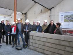 Pose de la première pierre à la Filature de Ronchamp, par le Président de la Communauté de Communes Rahin et Chérimont René Grosjean
